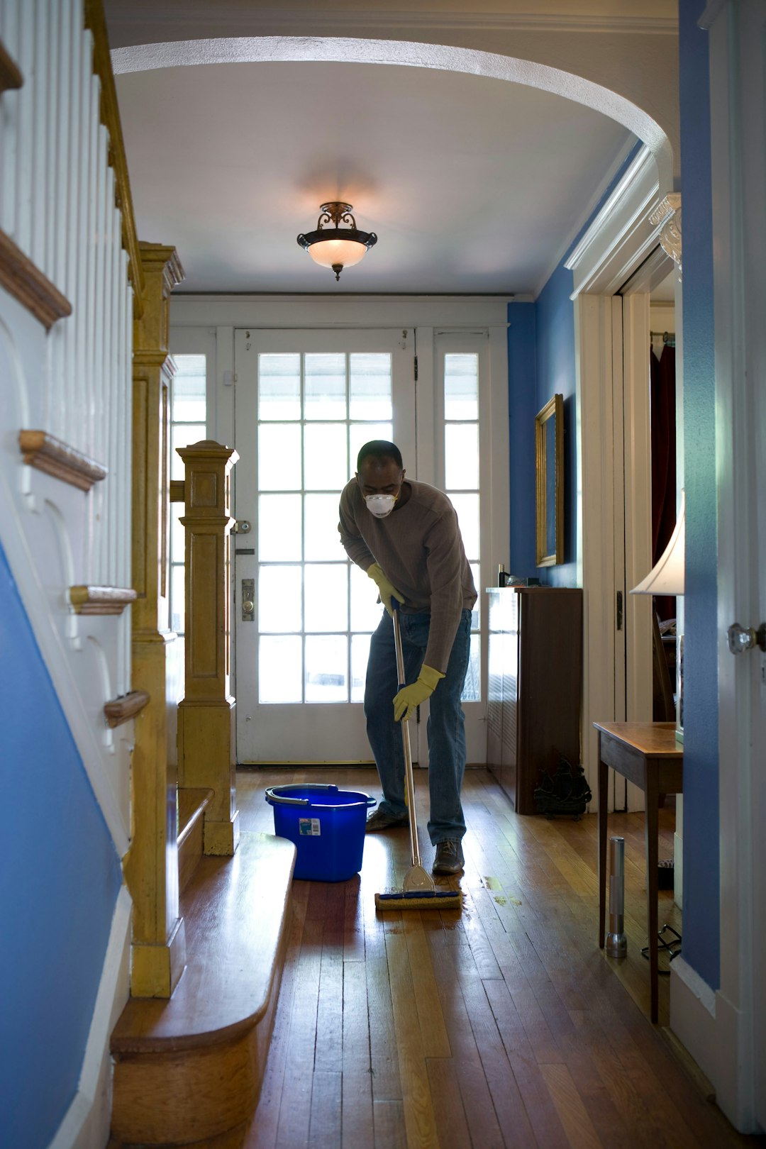 portfolio-03 This African-American man was in the process of damp-mopping his home’s entrance way. In this way airborne particulates including dust and pollen, could be removed from the inside of his home, thereby, reducing the detrimental effects these substances have upon the respiratory system of his family members. These irritants can sometimes result in sinus infections, and asthma.